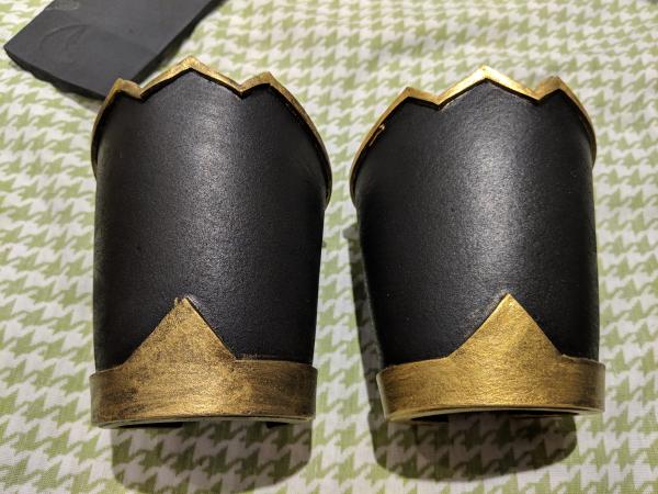 the bracers comparing one coat of gold on the left vs two on the right